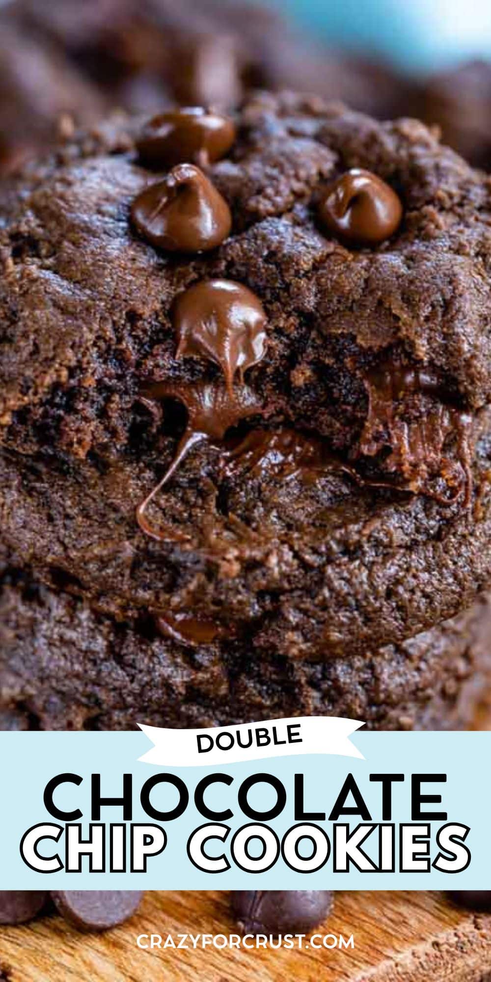 Close-up of thick, moist double chocolate chip cookies stacked together, showcasing gooey melted chocolate chips and chunks inside. Text overlay reads Double Chocolate Chip Cookies.