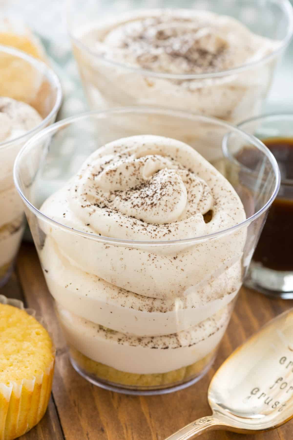 tiramisu in a clear plastic cup.