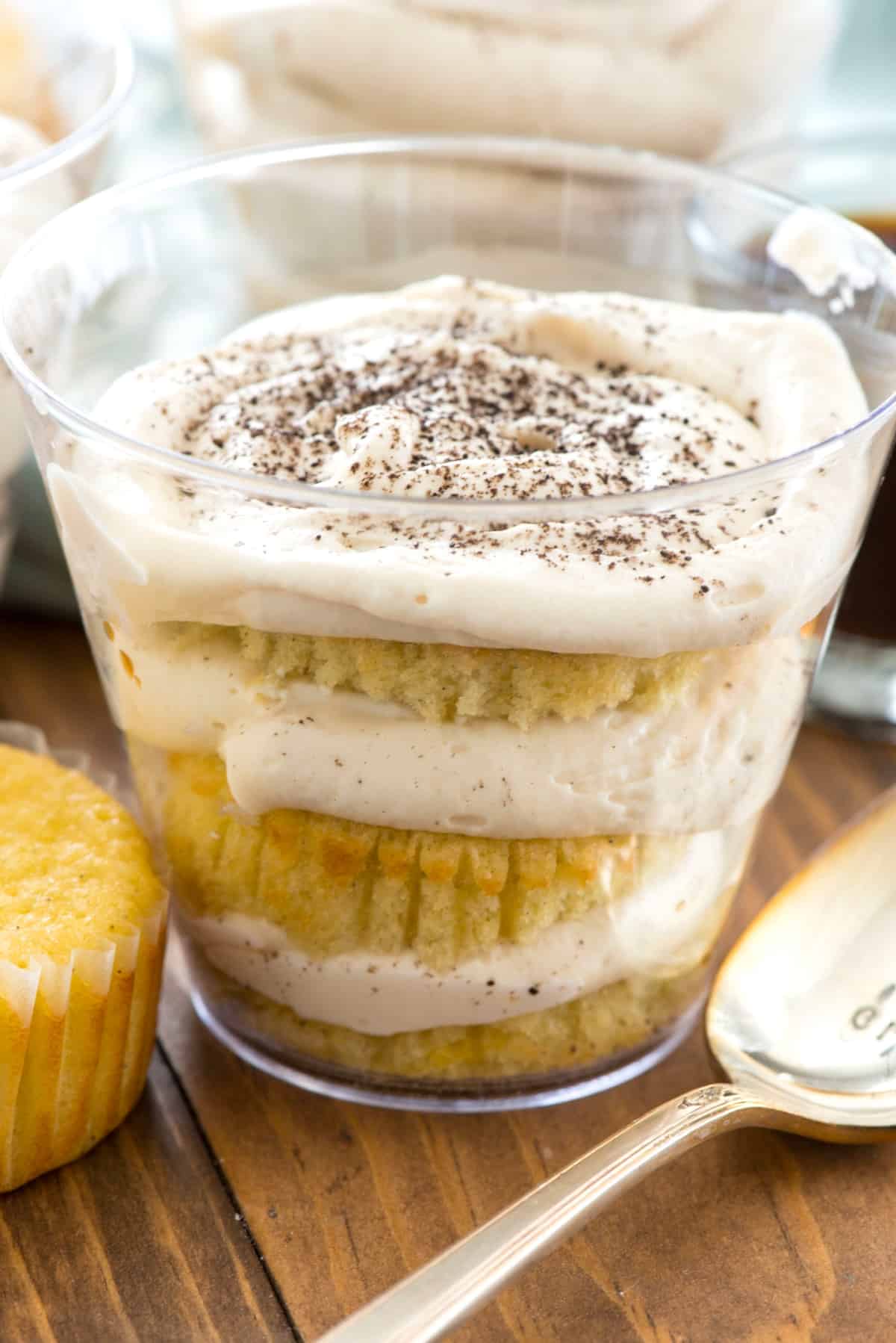 tiramisu in a clear plastic cup.