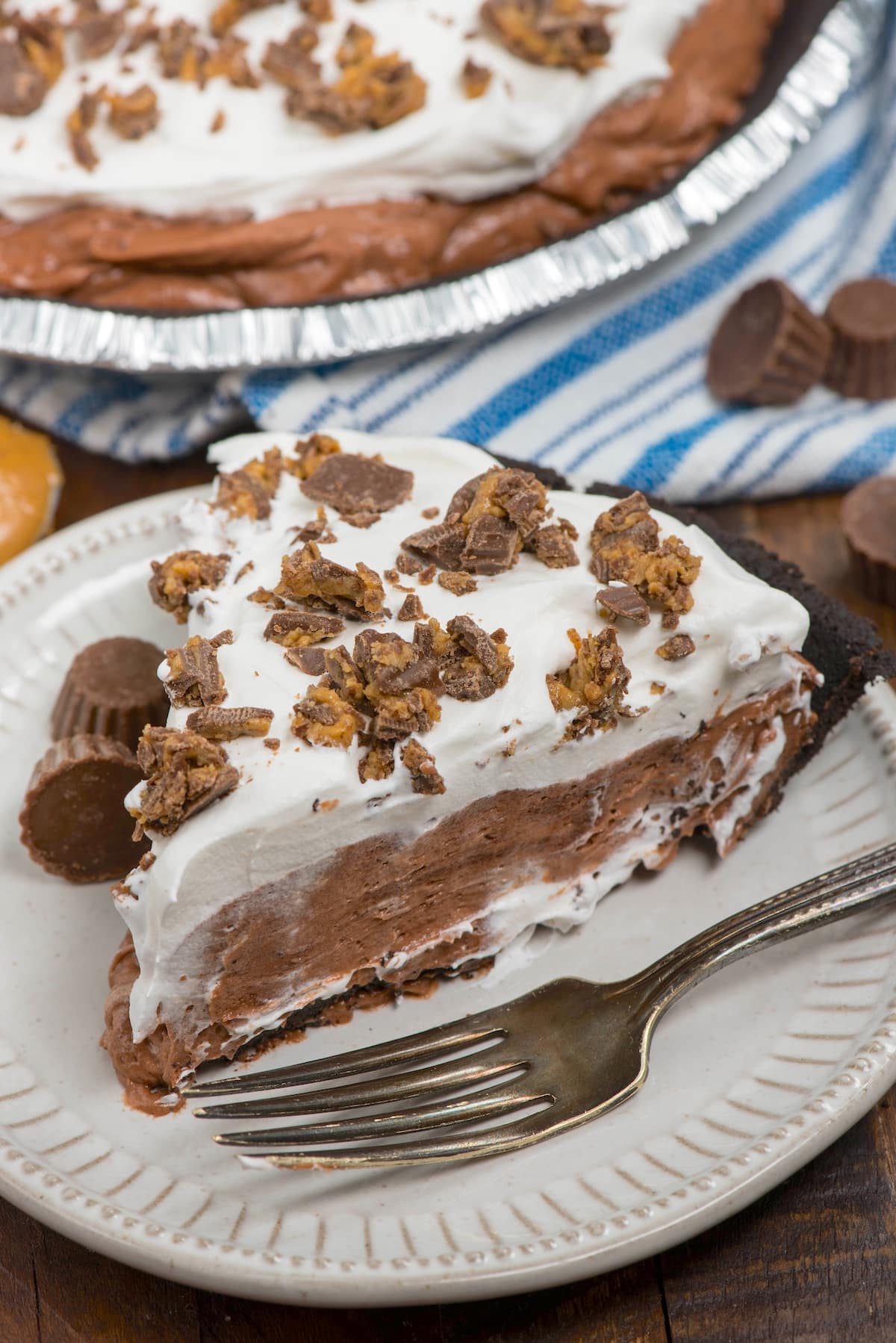 slice of pie on white plate with bite missing.