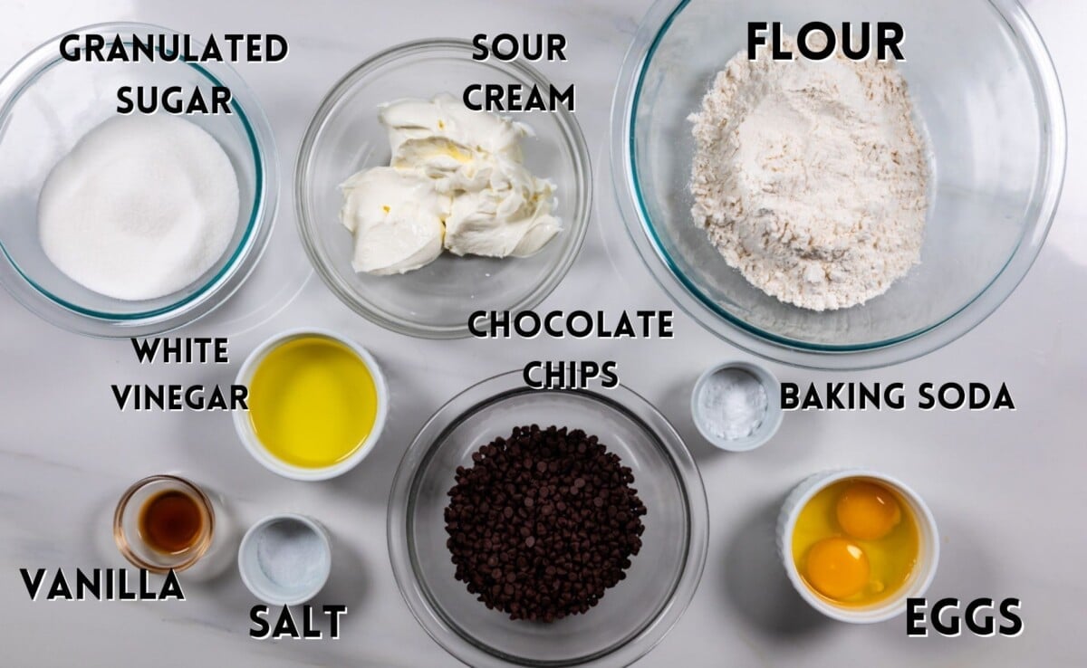ingredients in chocolate chip muffins laid out on a marble counter.
