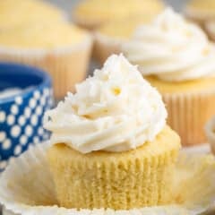 cupcakes with buttercream frosting and coconut shredded on top.