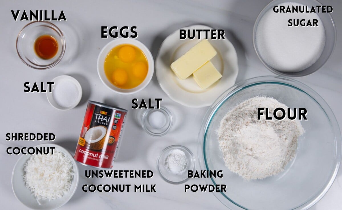 ingredients in coconut cupcakes laid out on a white counter.