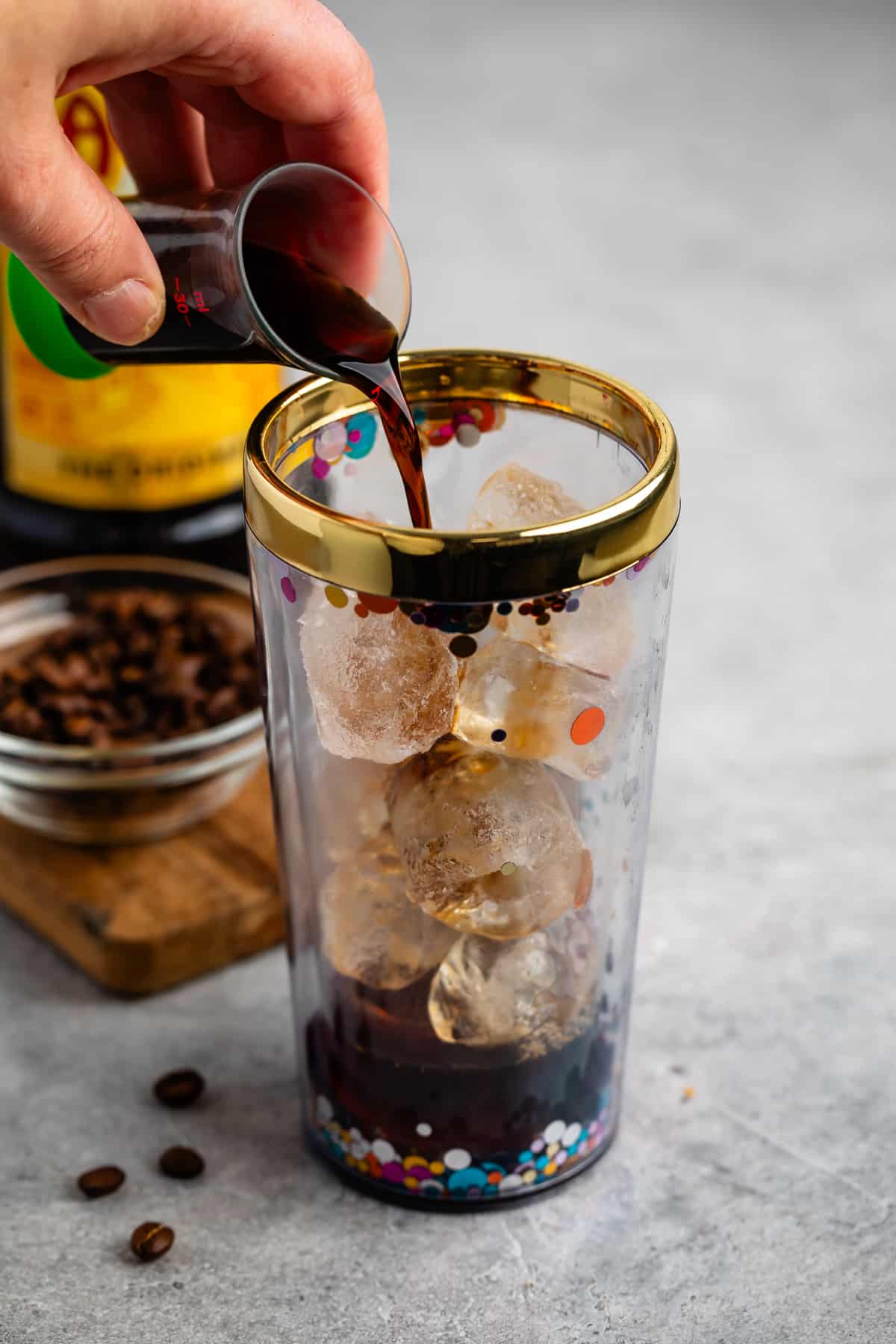 process shot of espresso martini being made and poured.