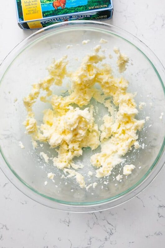 creamed butter and sugar in large bowl with butter box.