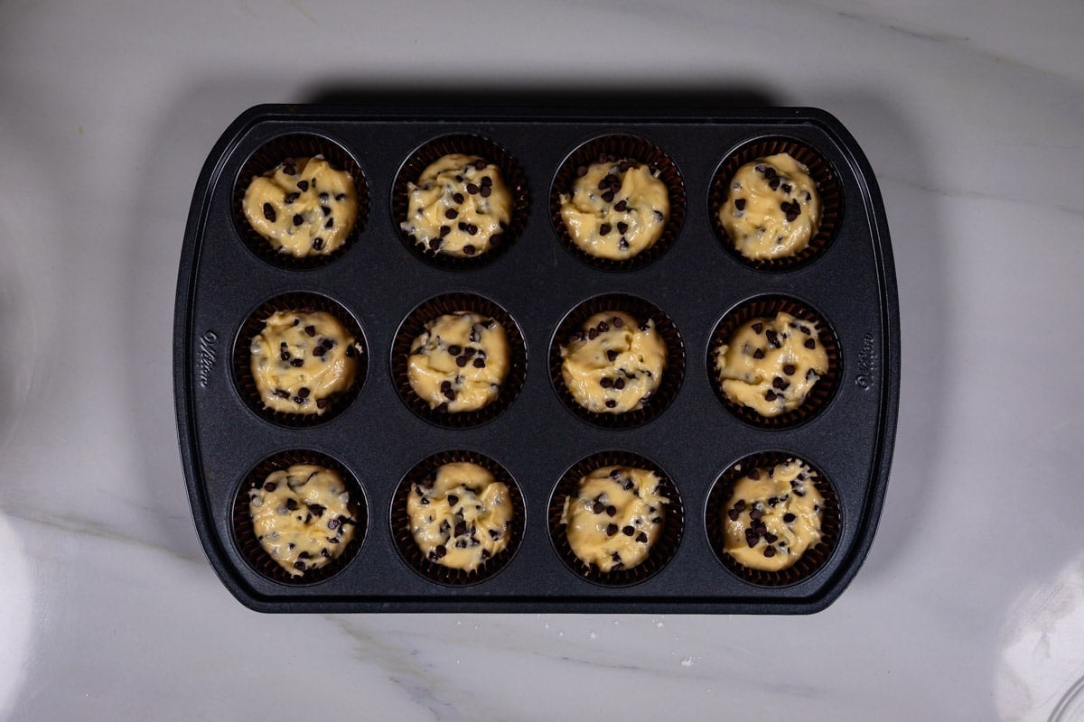 process shot of chocolate chip muffins being made.