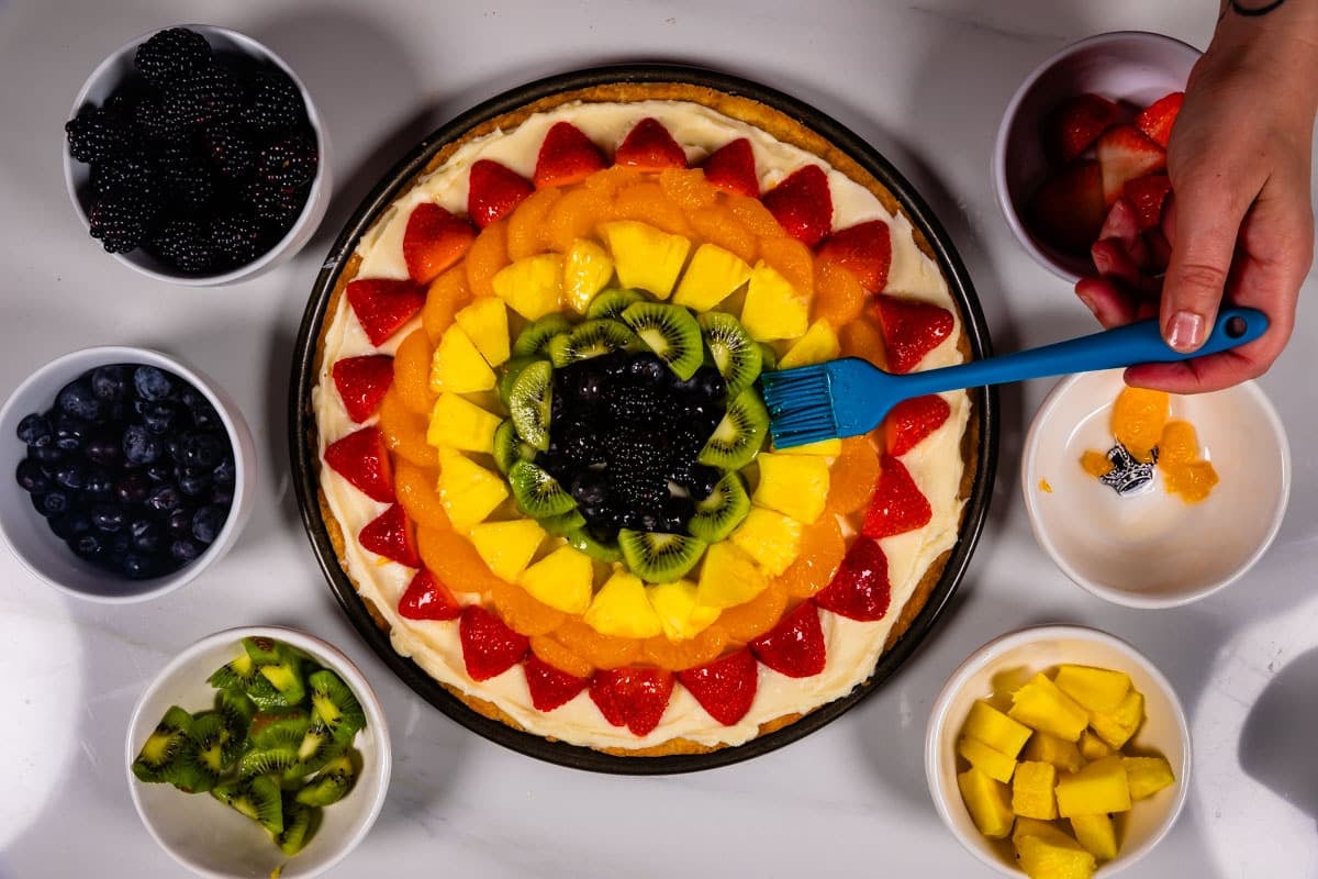 process shot of fruit pizza.