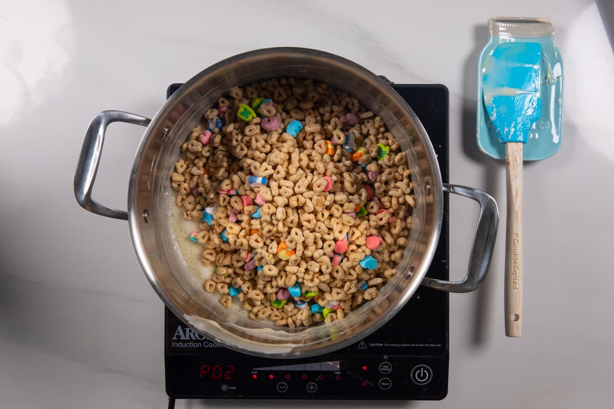 process shot of lucky charms Rice Krispie treats being made.