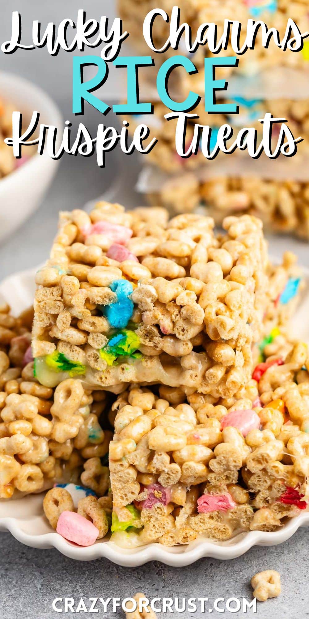 stacked Rice Krispie treats made from lucky charms on a white plate with words on the image.