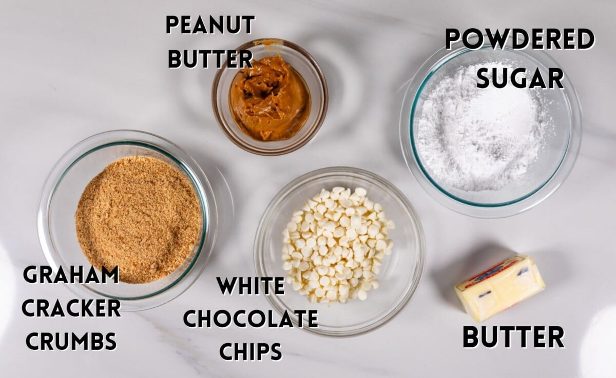 ingredients in no bake peanut butter bars laid out on a marble counter.