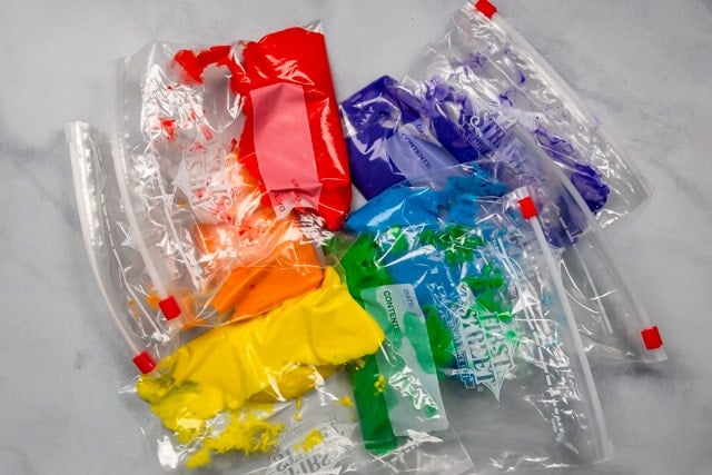 rainbow cake batter in ziploc bags.