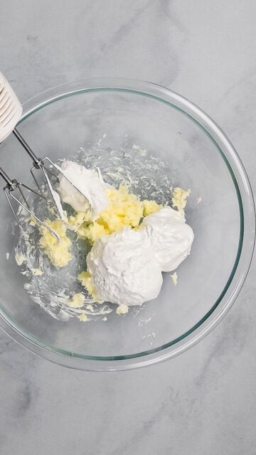 butter and marshmallow fluff in clear bowl.