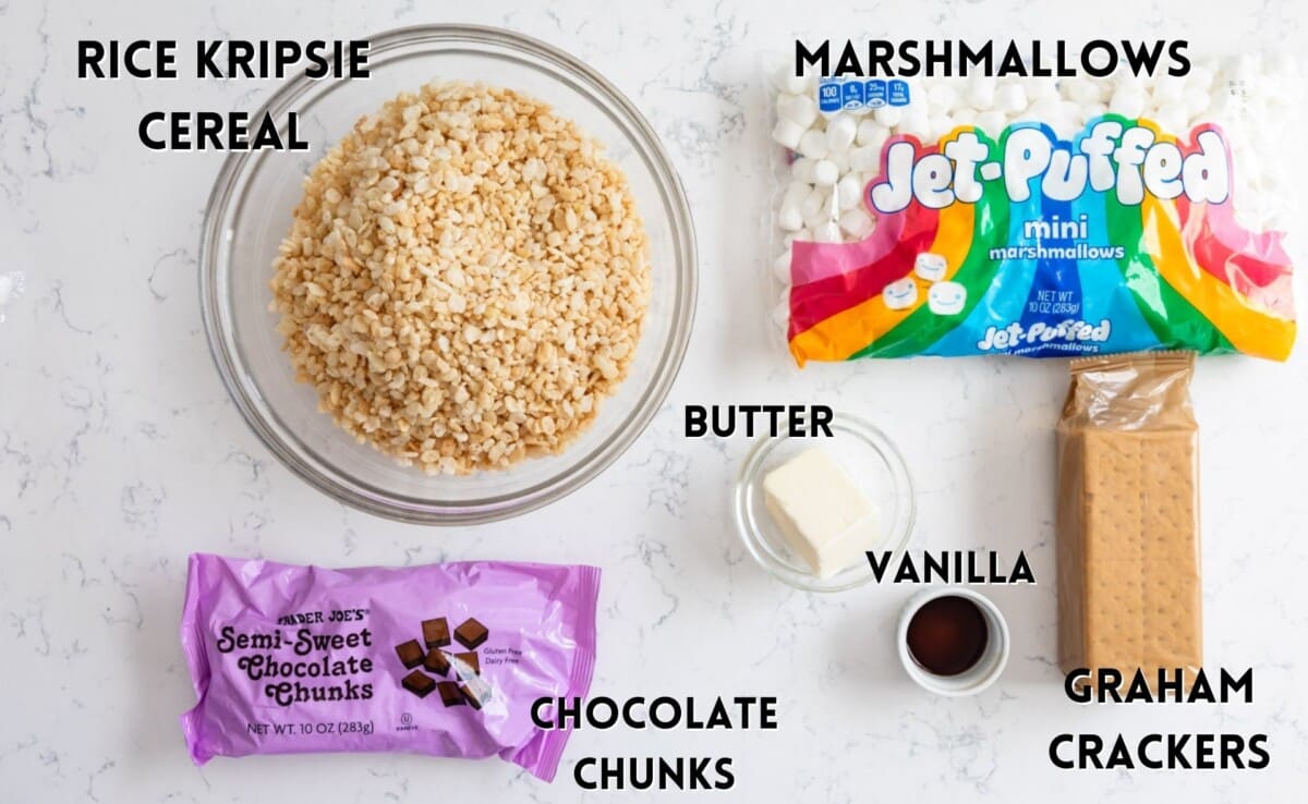 ingredients in smores Rice Krispie treats laid out on a marble counter.