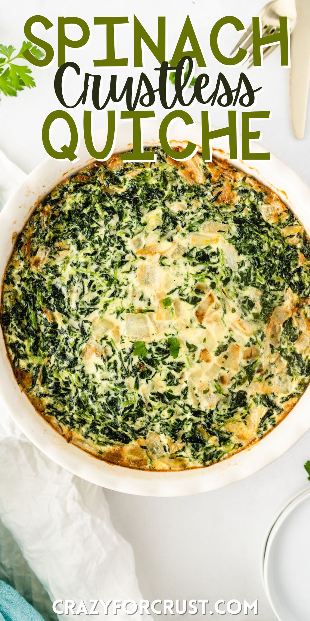 quiche made with spinach in a white dish with words on the image.