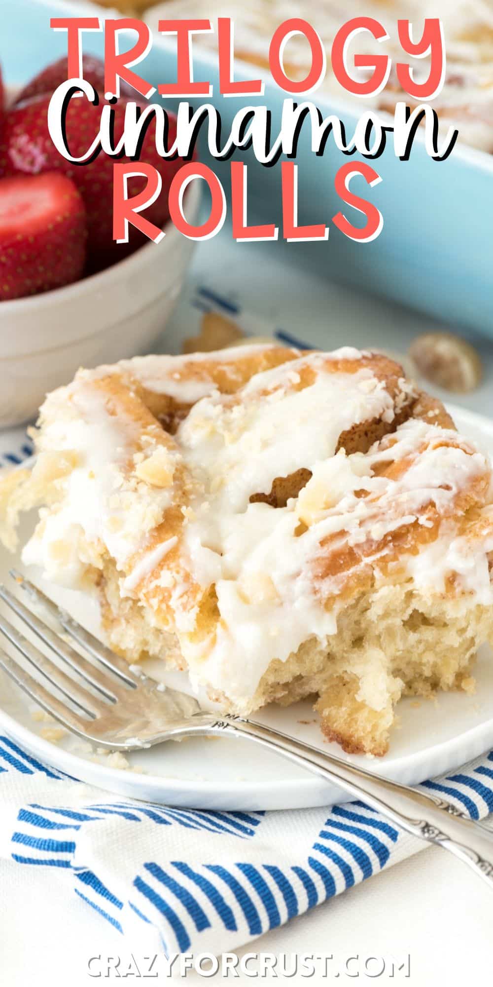 one cinnamon roll on a white plate with a fork with words on the image.