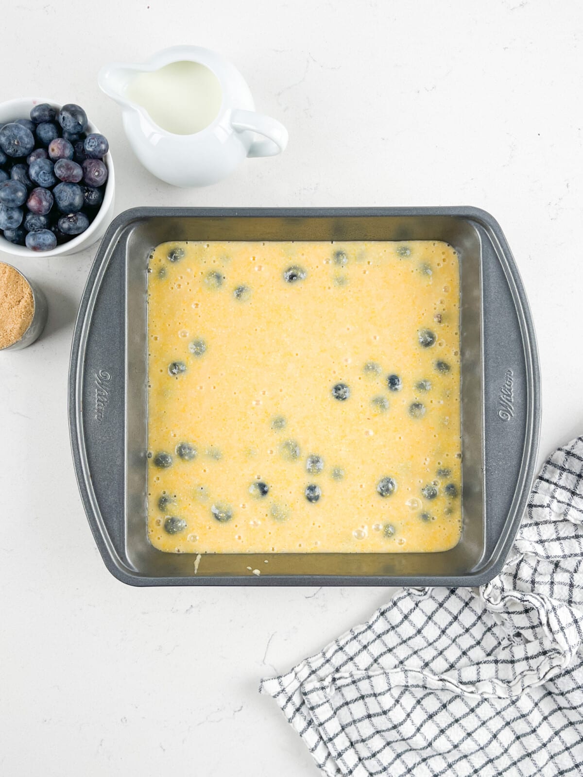 process shot of blueberry cornbread being made.