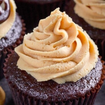 chocolate cupcakes with peanut butter frosting on top.