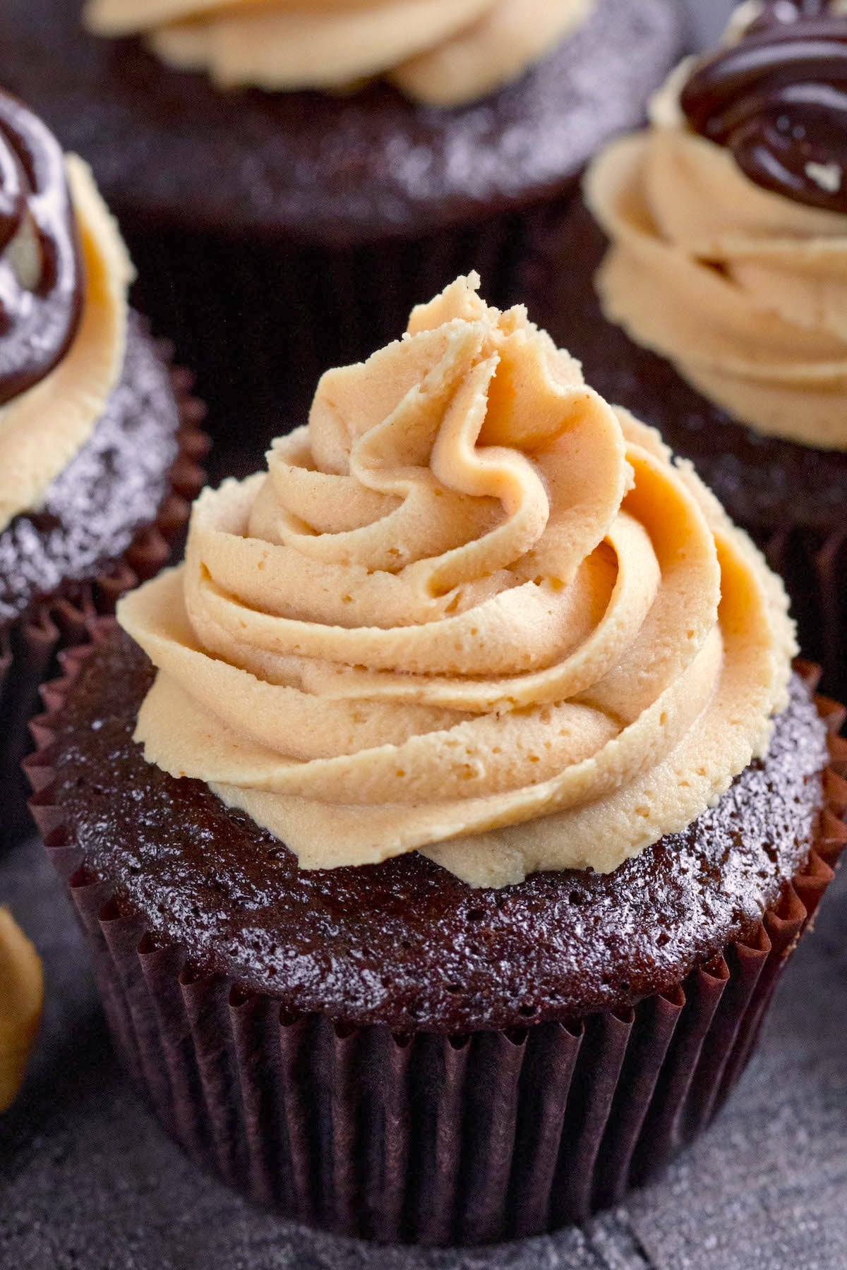 chocolate cupcakes with peanut butter frosting on top.