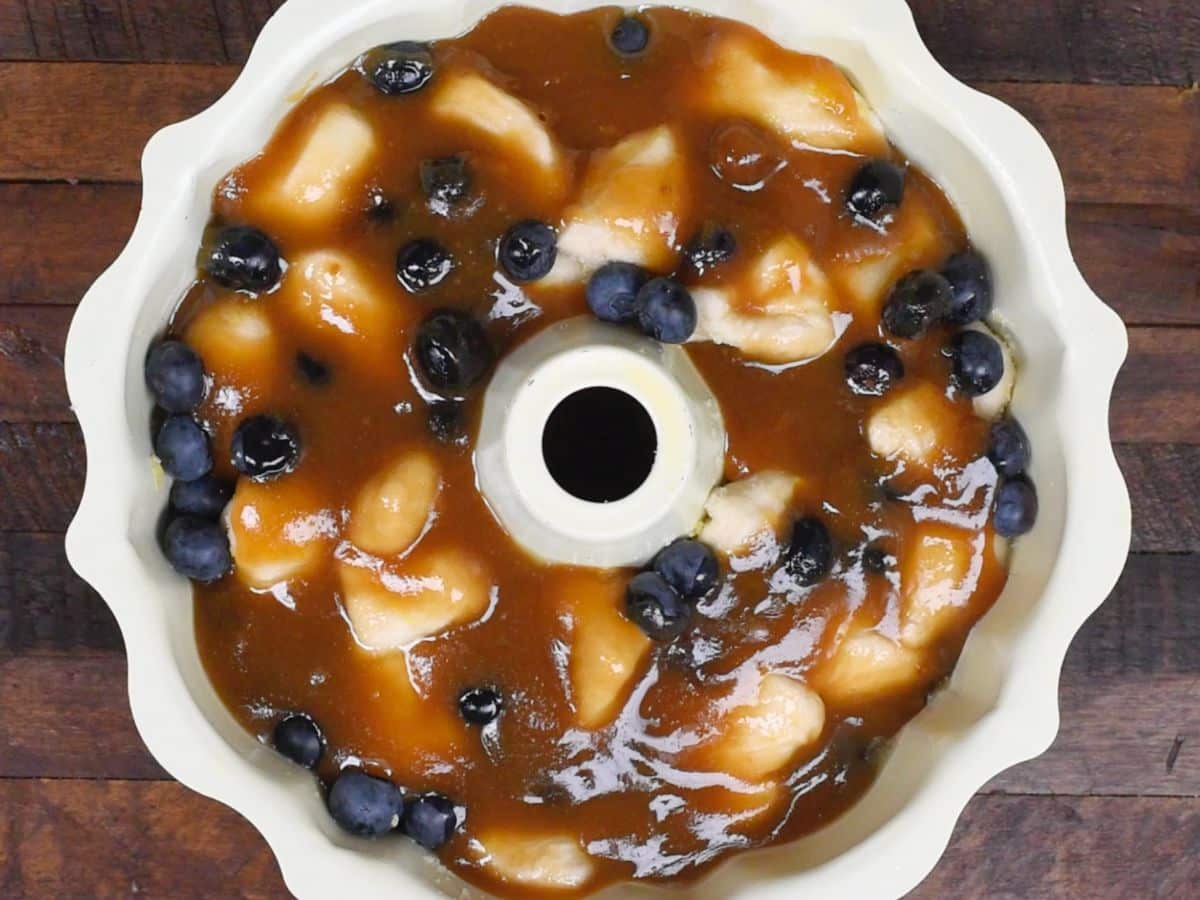 process shot of blueberry lemon monkey bread being made.