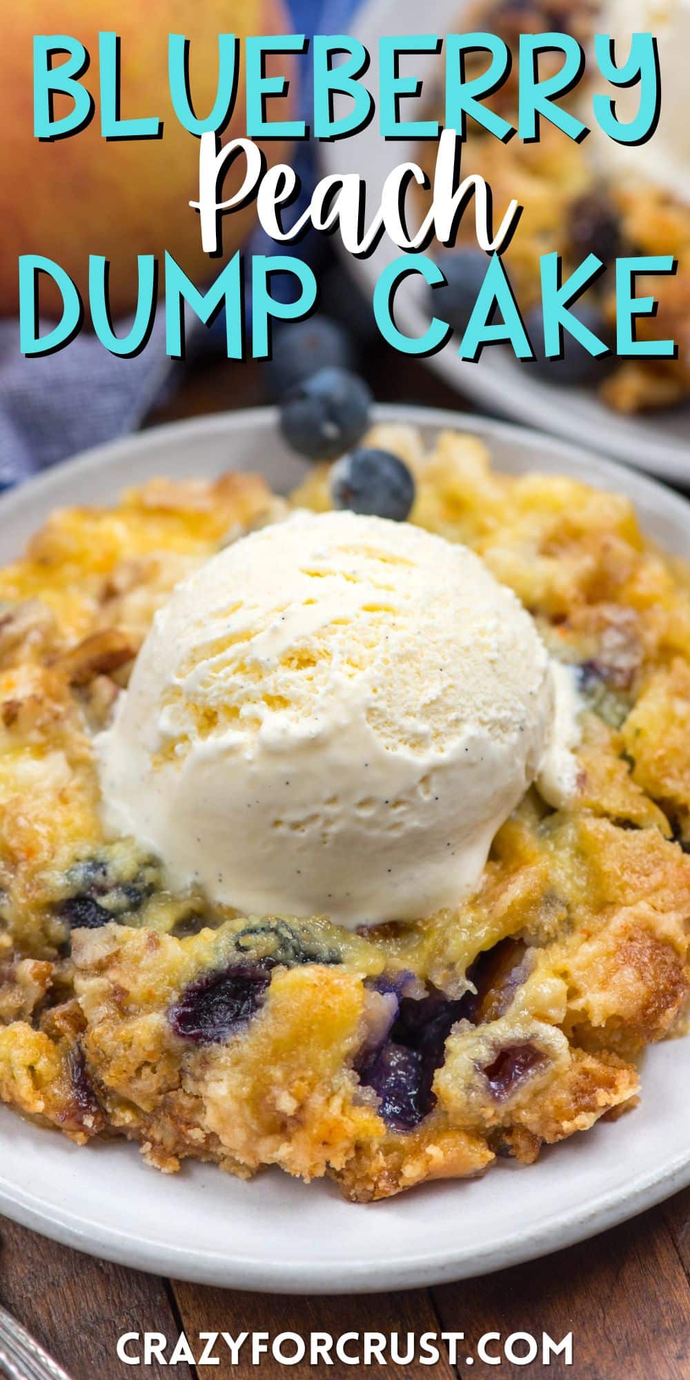 dump cake on a grey plate with blueberries mixed in and a scoop of ice cream on top with words on the image.