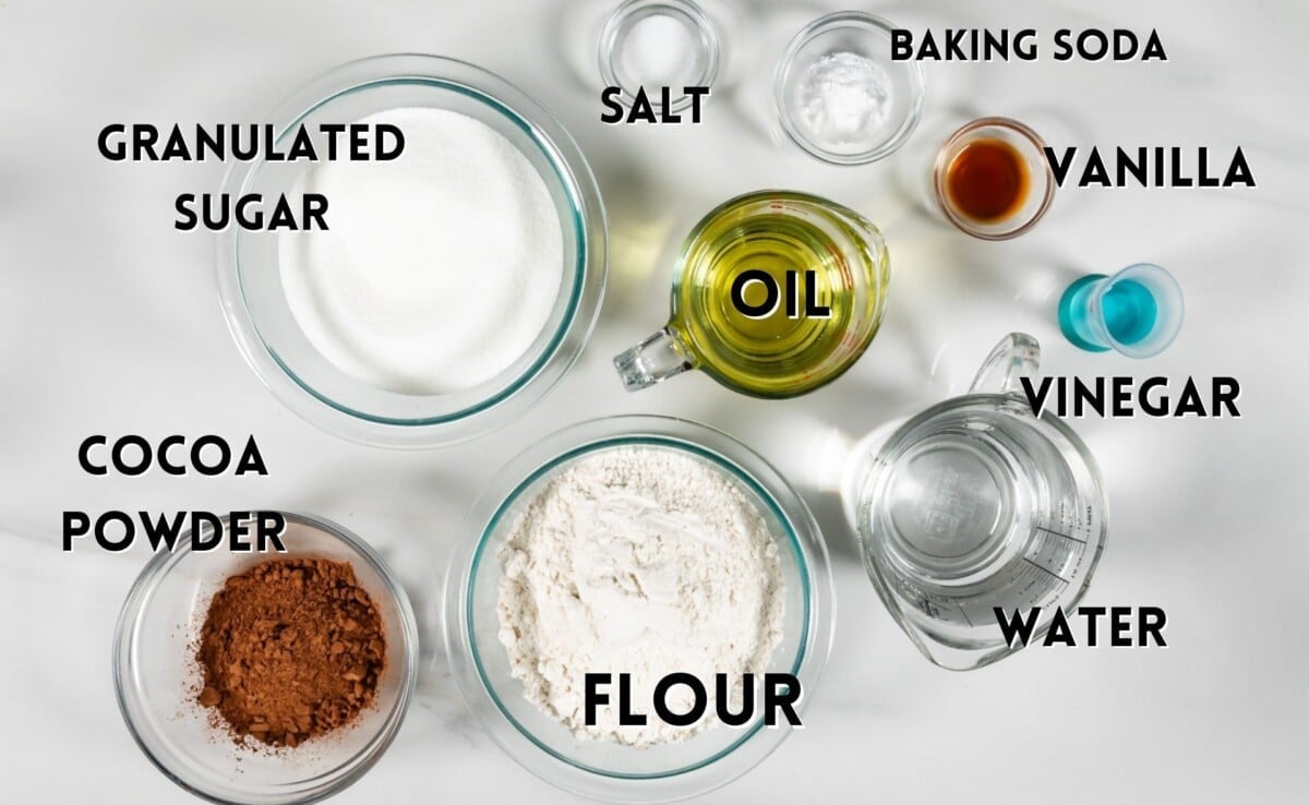 ingredients in chocolate cupcakes laid out on a marble counter.
