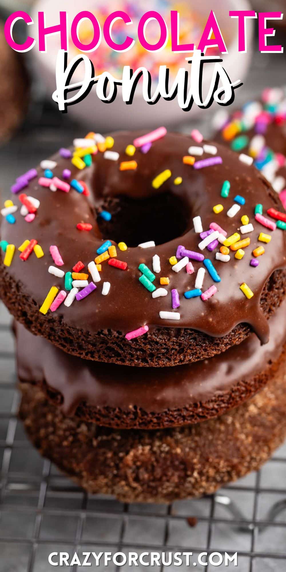 stacked chocolate donuts with chocolate glaze and colorful sprinkles on top with words on the image.