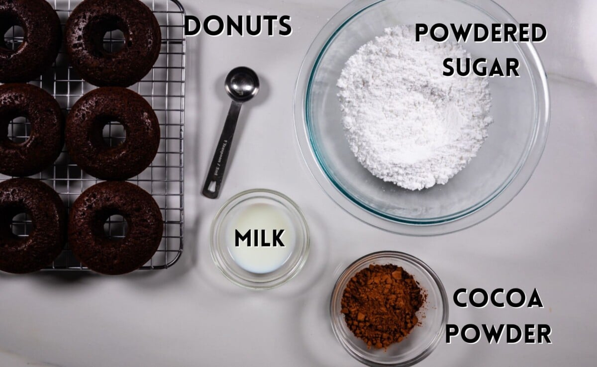 ingredients in chocolate donuts glaze laid out on a white counter.