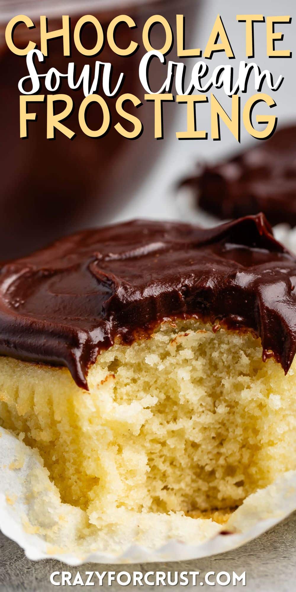 yellow cupcakes topped with chocolate sour cream frosting with words on the image.