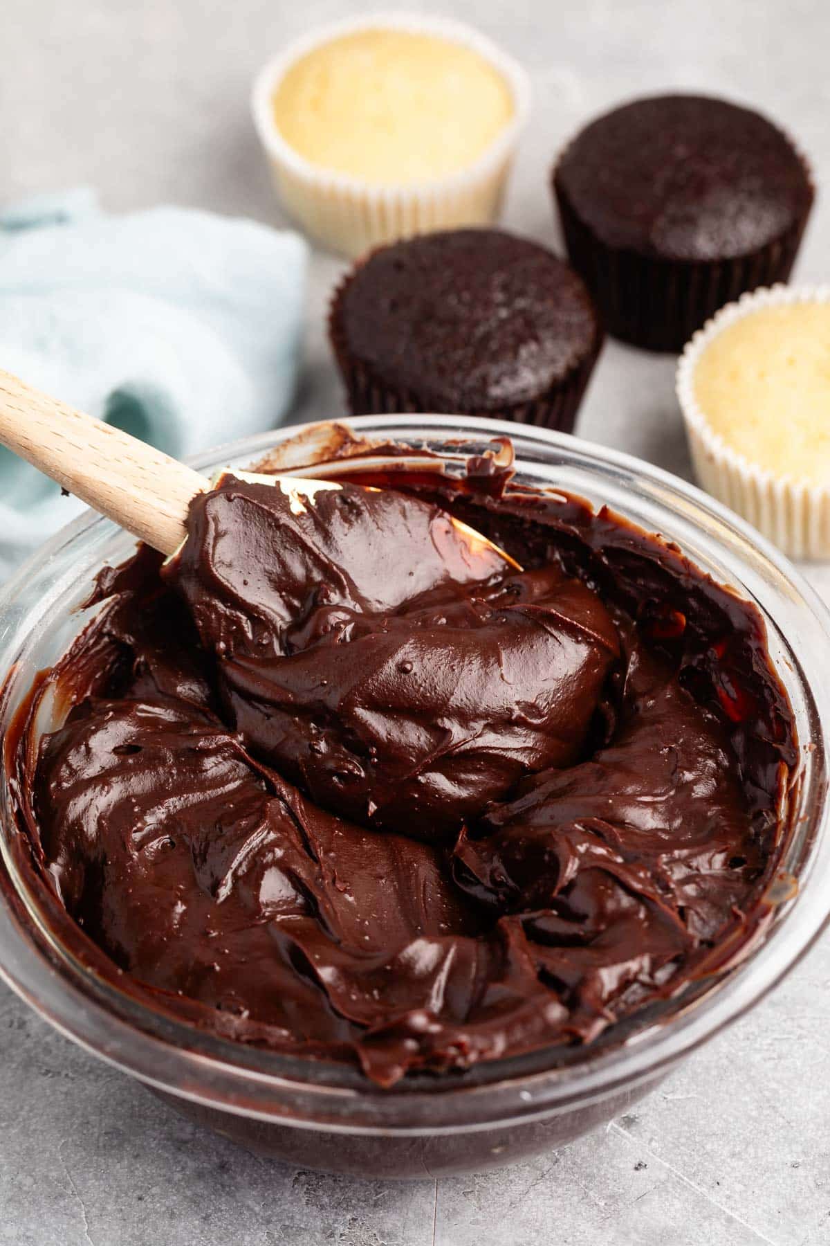 chocolate frosting in a clear bowl.