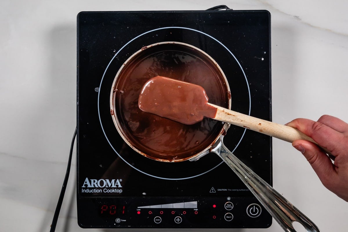 process shot of chocolate frosting being made.