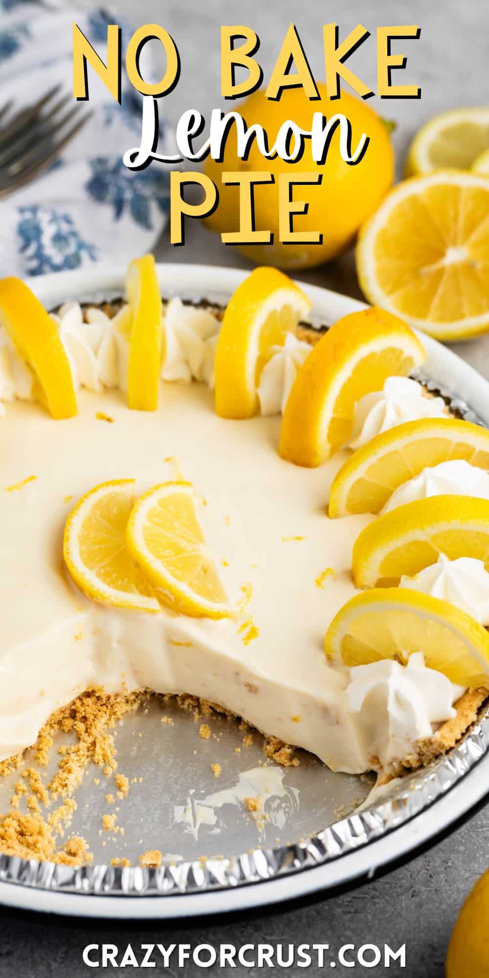 lemon pie in a tin with sliced lemons on top with words on the image.
