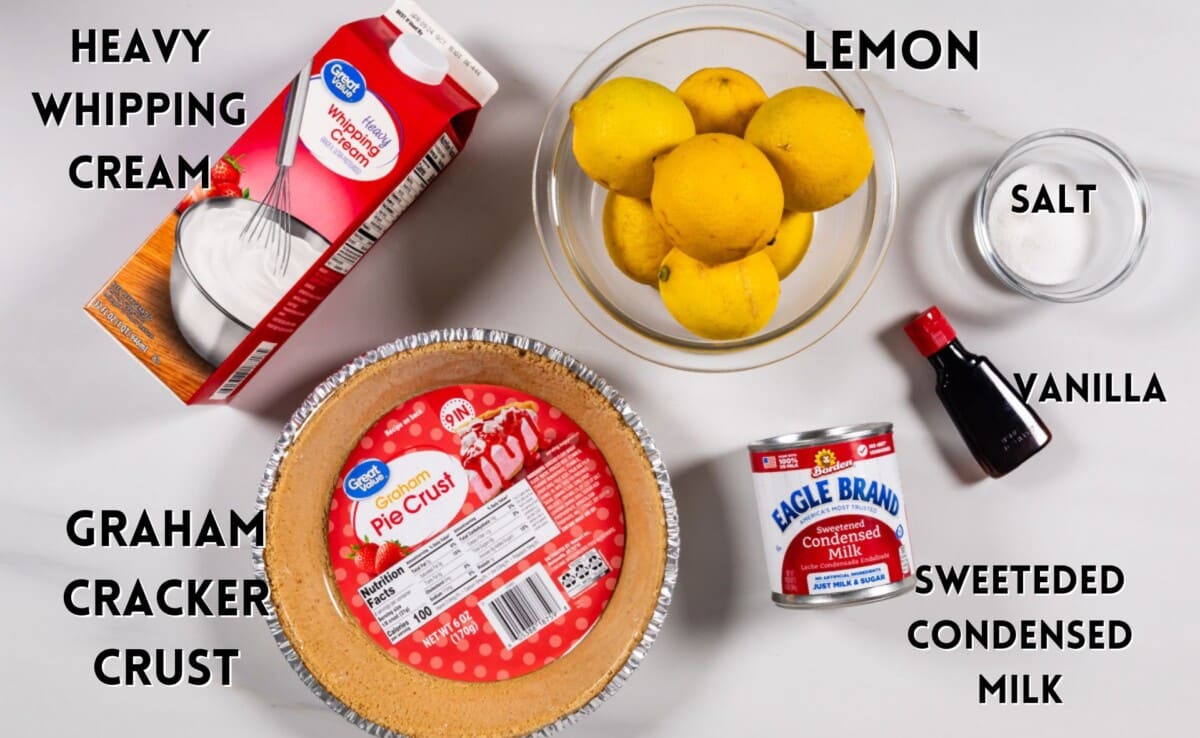 ingredients in lemon pie laid out on a white marble counter.