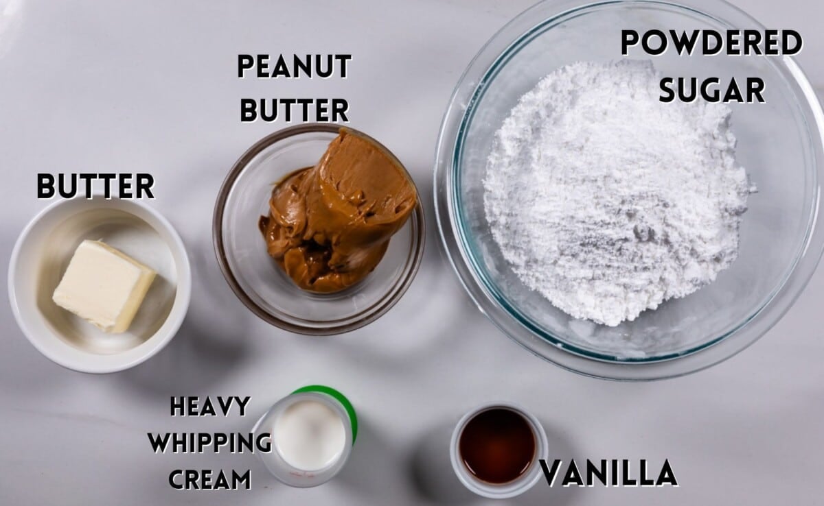 ingredients in peanut butter frosting laid out on a white counter.