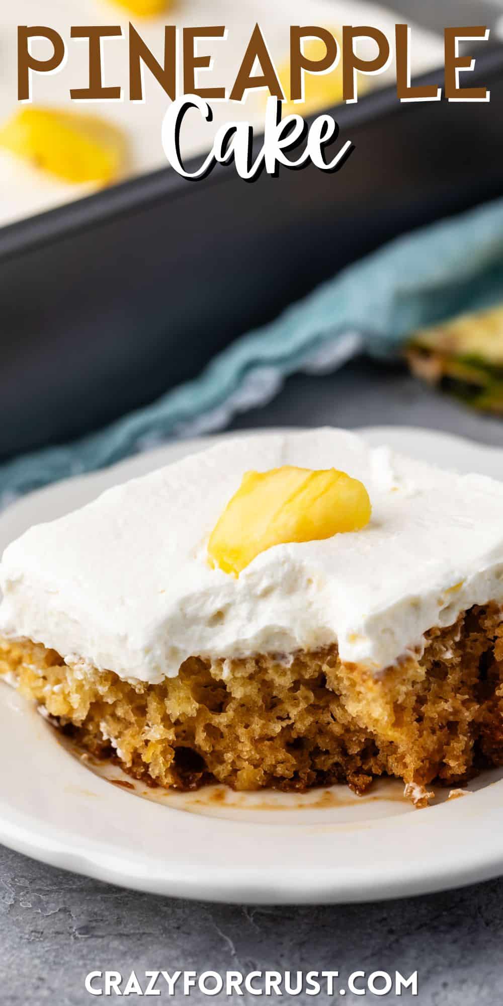 pineapple cake with white frosting on top and with a sliced pineapple with words on the image.