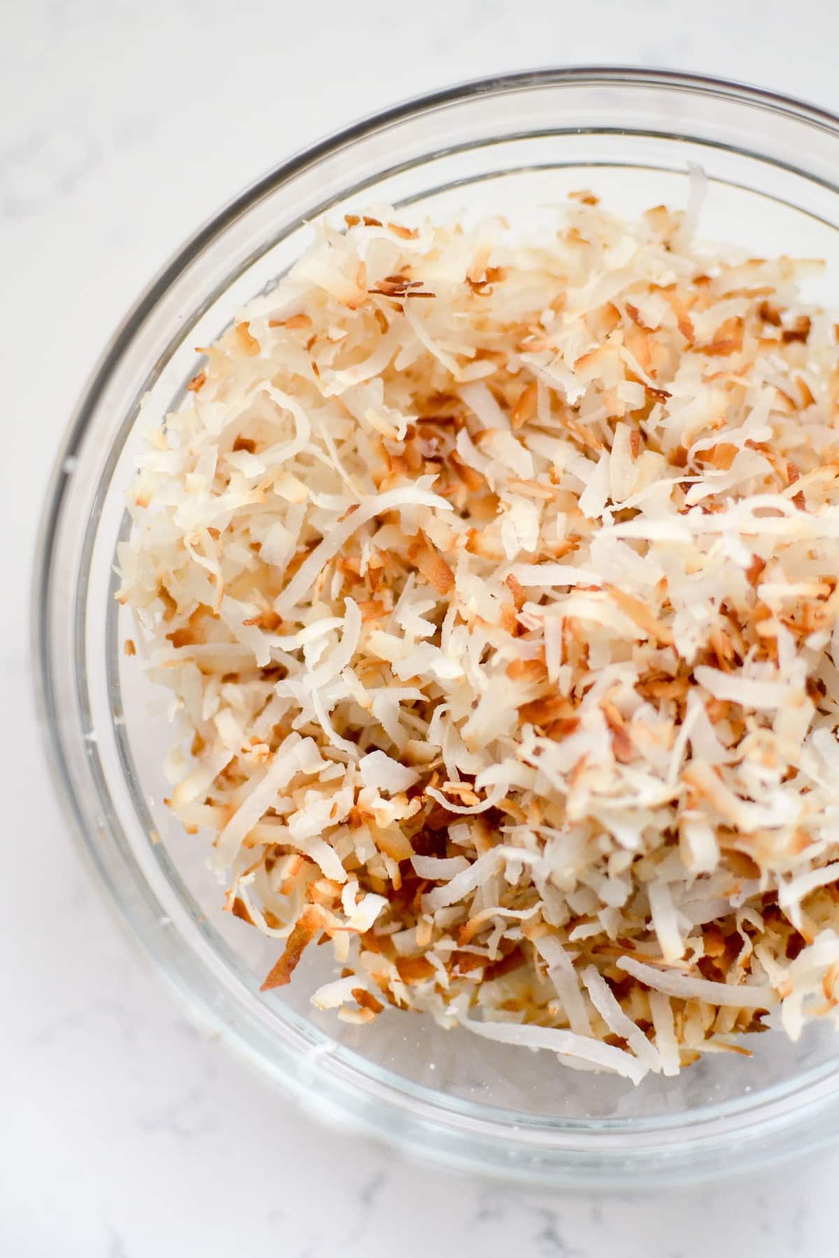 shredded coconut in a clear bowl.