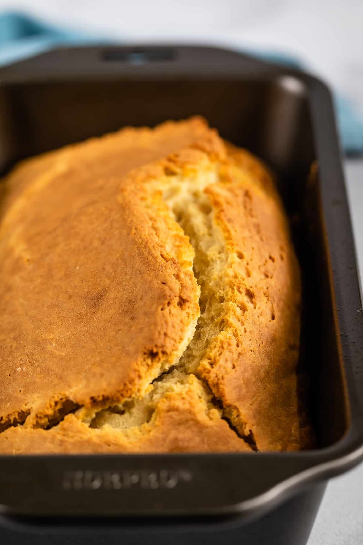 no yeast bread sitting in a grey loaf tin.
