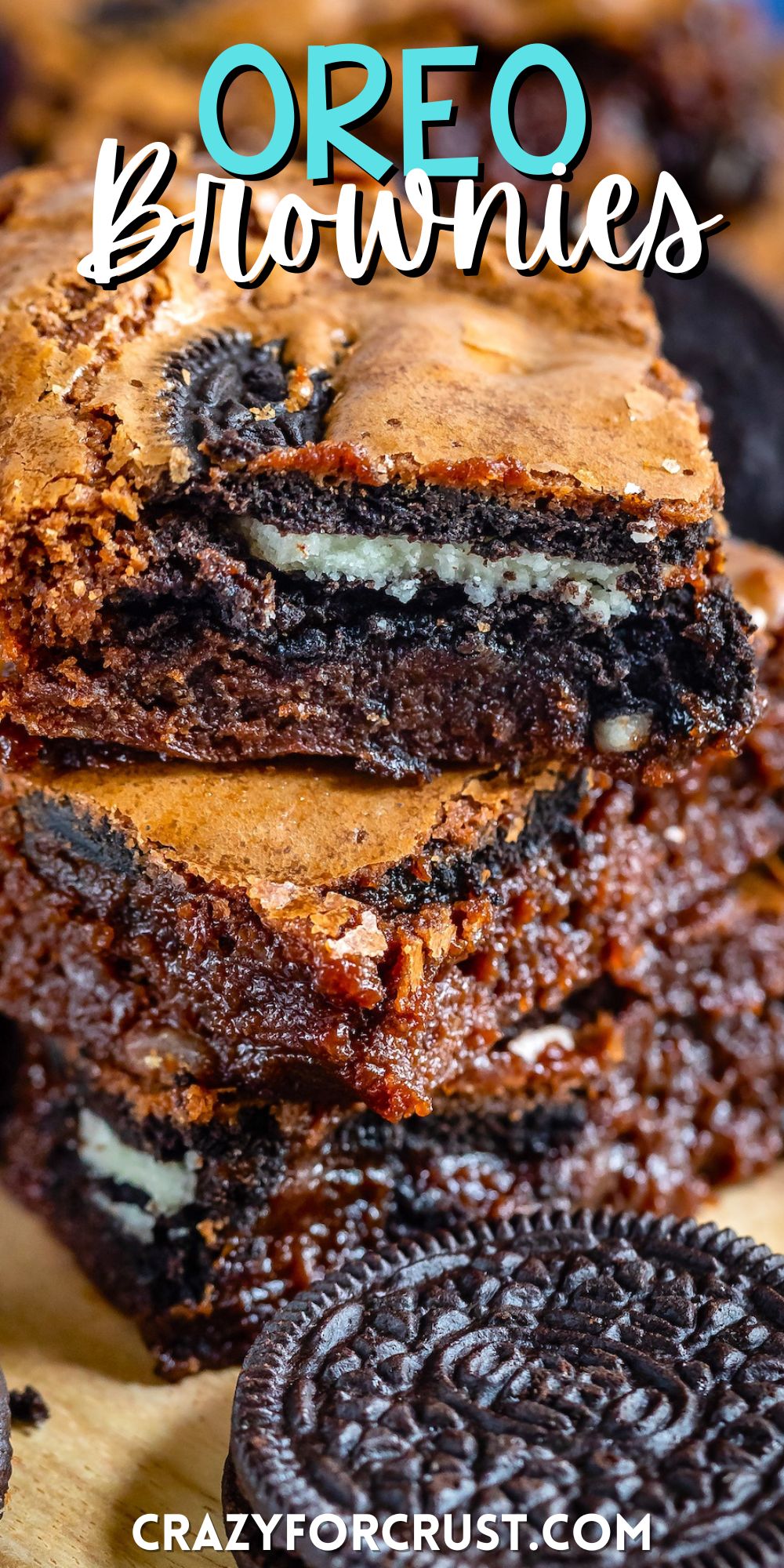 stacked oreo brownies on a cutting board with words on the image.