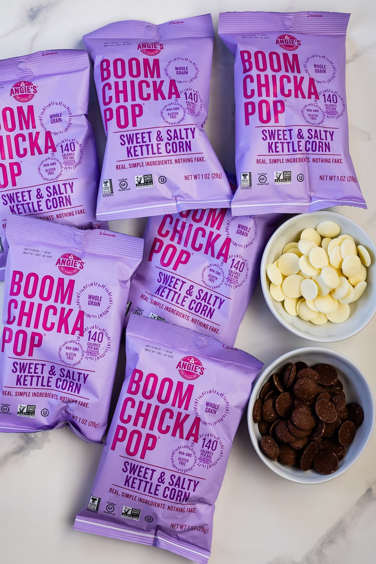 purple popcorn bags next to regular and white chocolate melts.