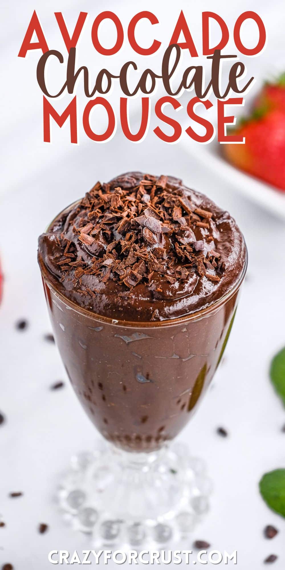 chocolate mousse in a tall clear glass with chocolate shavings on top with words on the image.