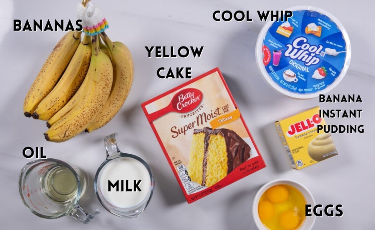 ingredients in banana pudding cake laid out on a white marble counter.