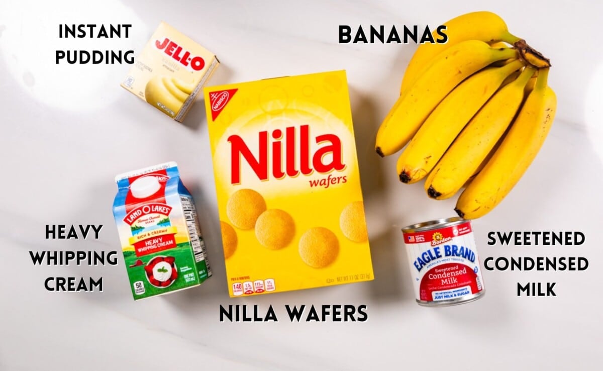 ingredients in banana pudding laid out on a white marble counter.