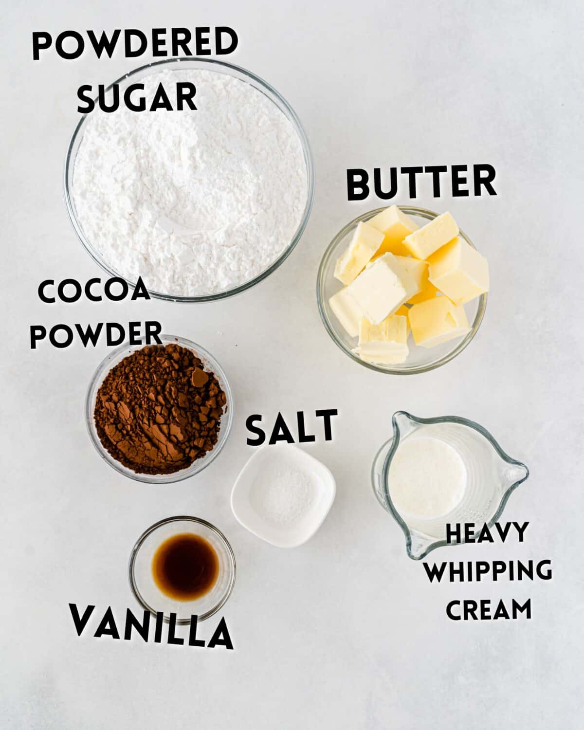 ingredients in birthday cake frosting laid out on a white counter.