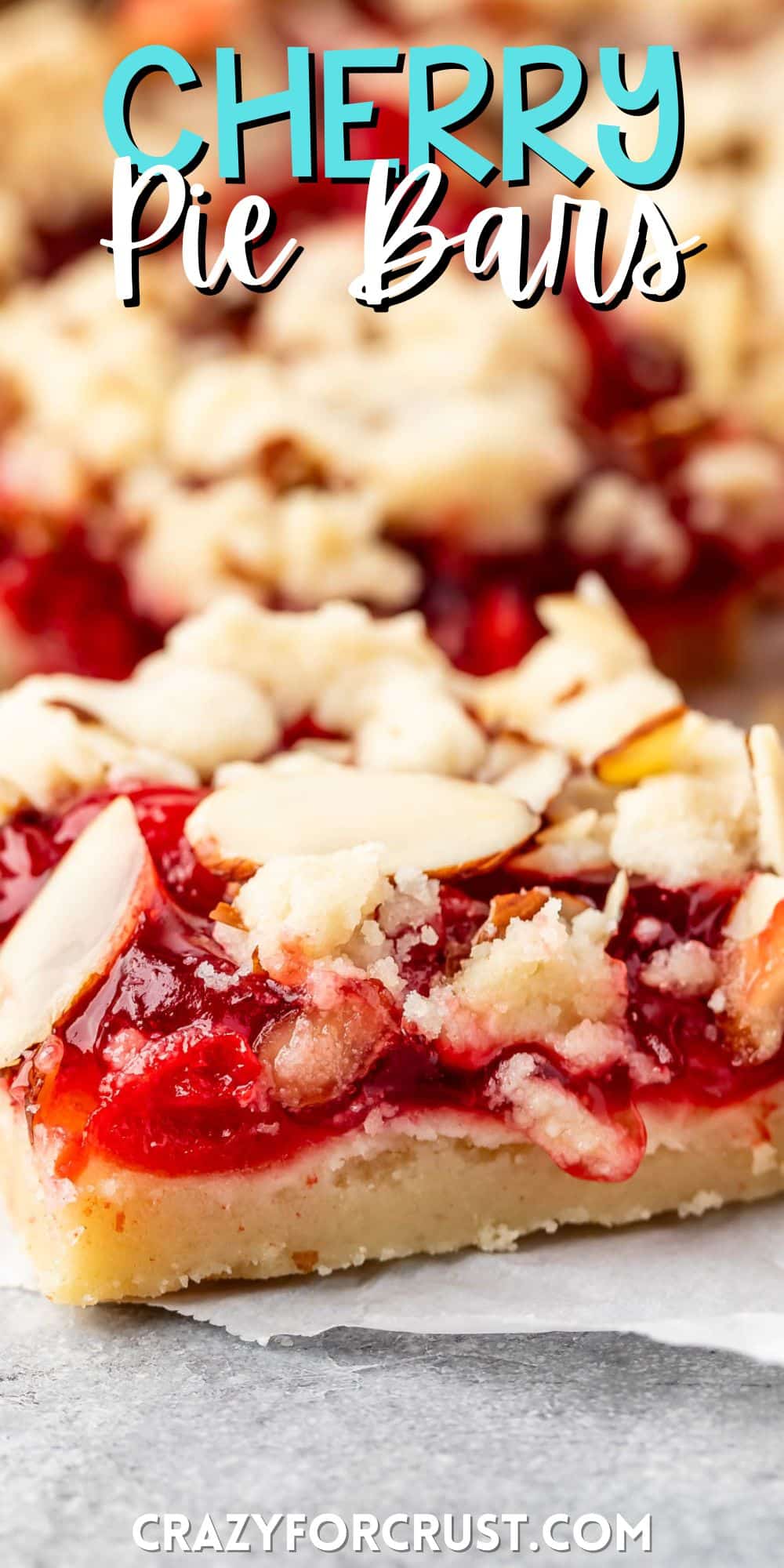 pie crust bars with red cherry pie filling and sliced almonds on top with words on the image.