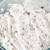 oreo frosting held in a clear bowl.
