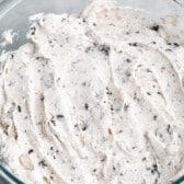 oreo frosting held in a clear bowl.