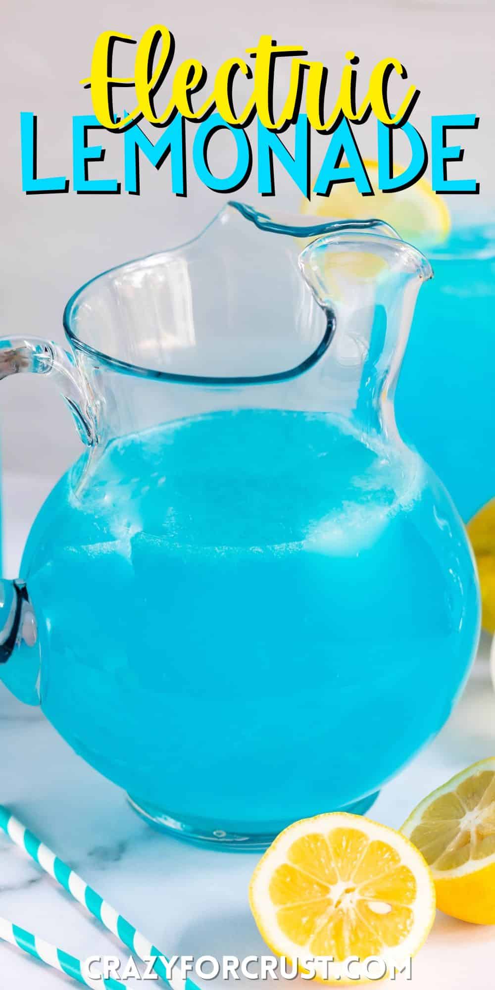 big glass pitcher filled with a bright blue drink and lemon sliced all around with words on the image.