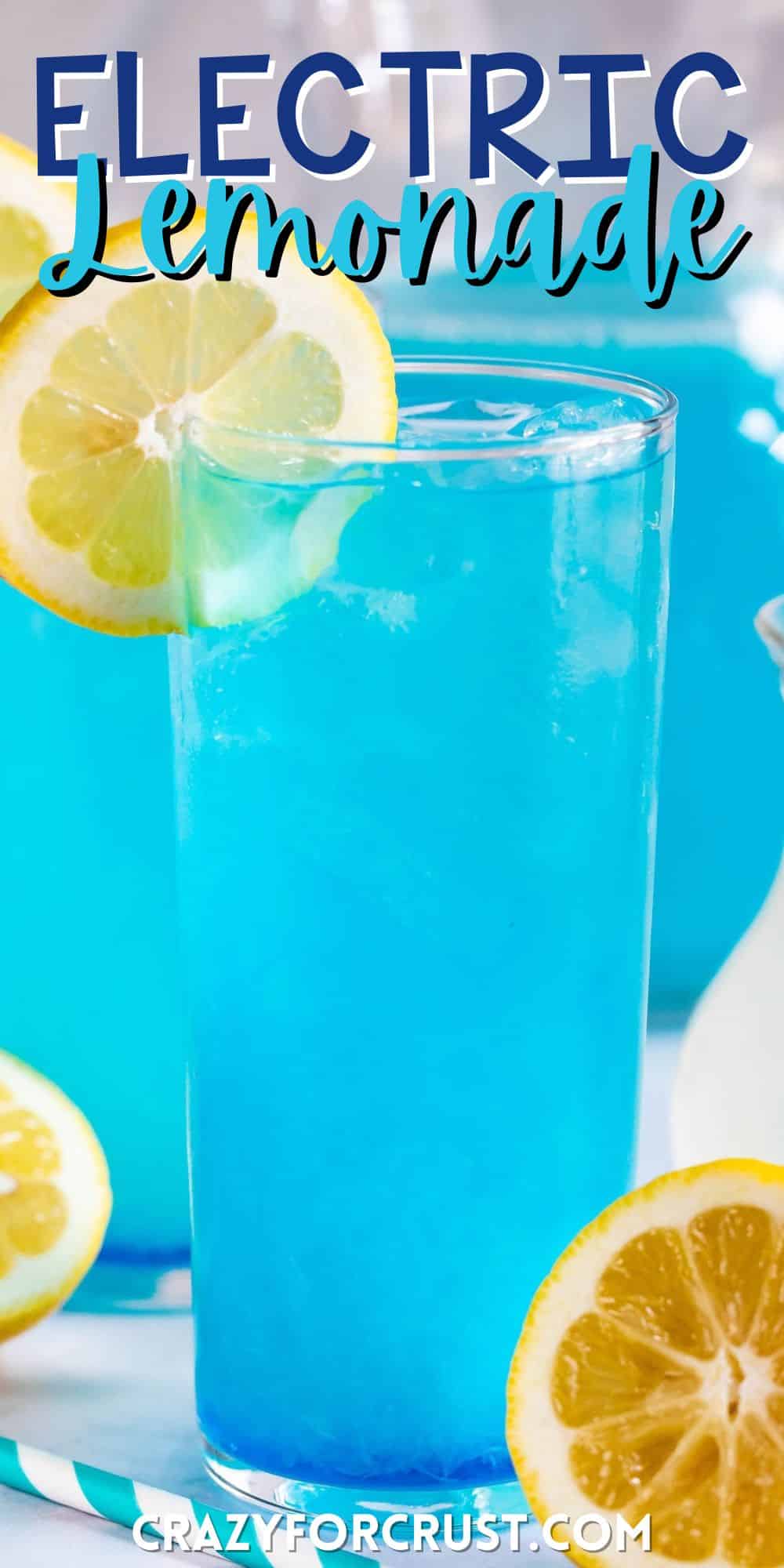 tall clear glass with a bright blue drink inside and a lemon slice on the rim with words on the image.