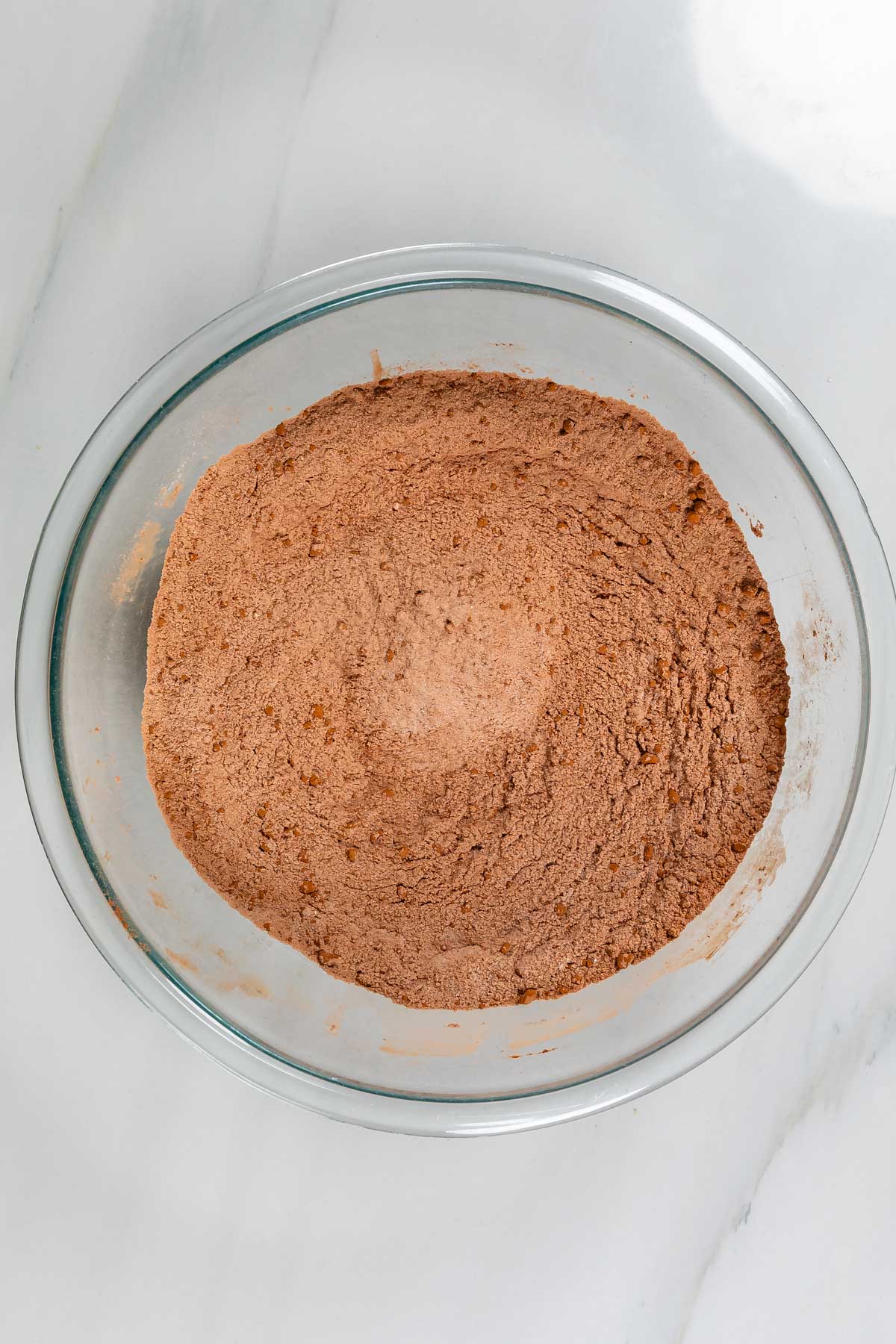 process shot of chocolate bundt cake being made.