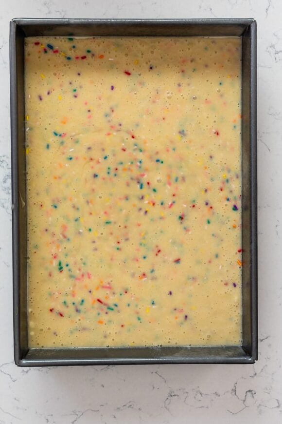 process shot of funfetti cake being made.