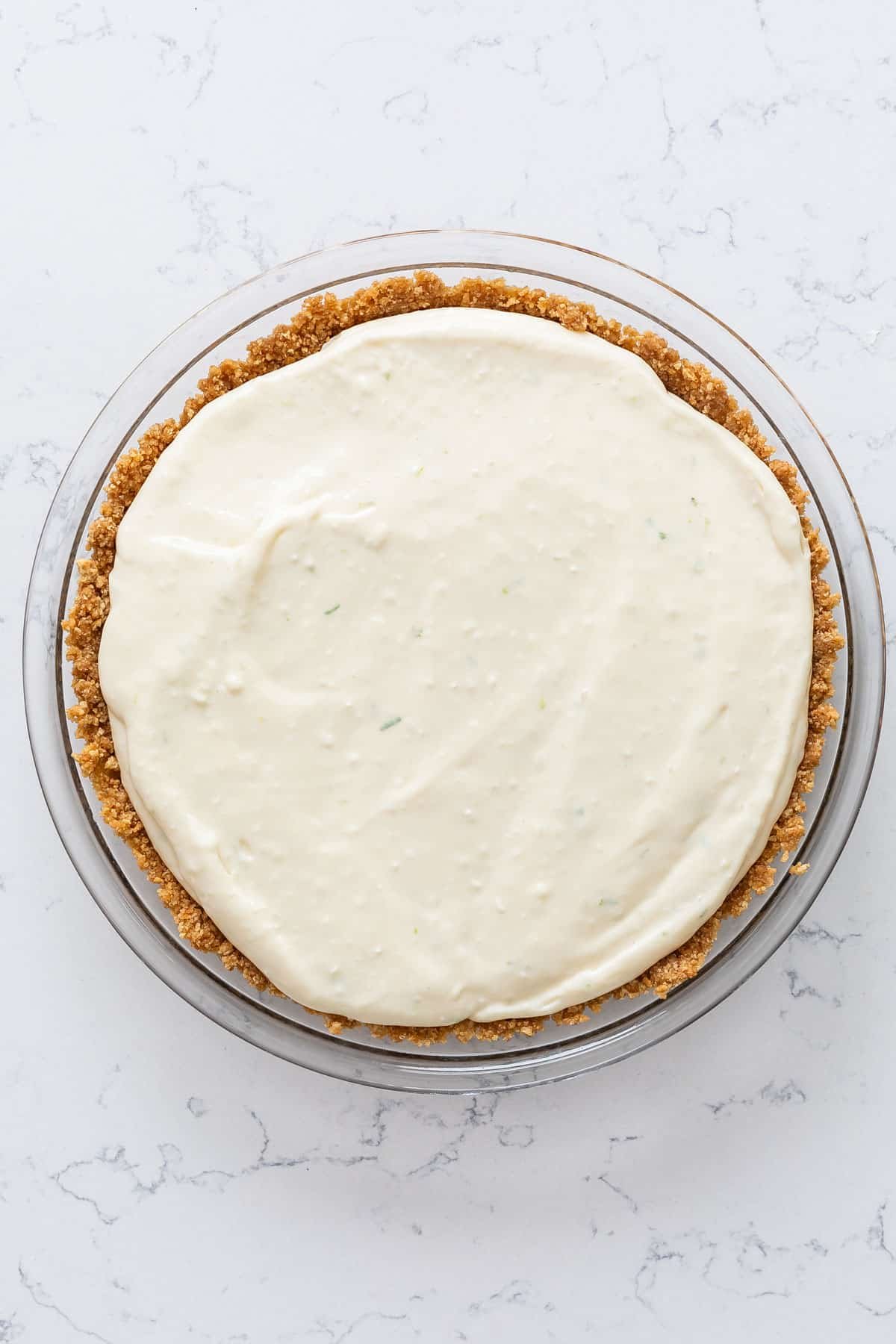 process shot of key lime pie being made.